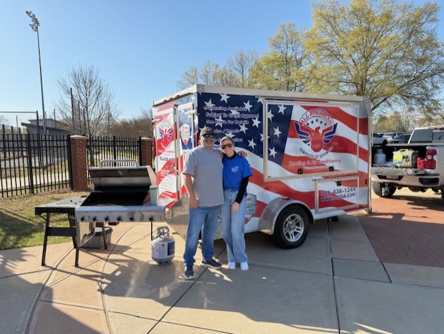 Man and Woman hugging at Community Event